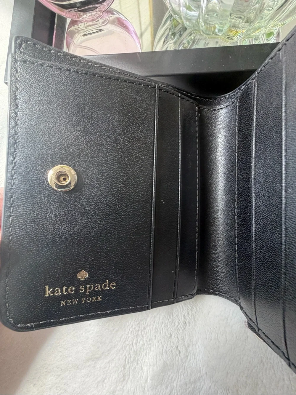 kate spade Black Pebbled Leather Zip Wallet with Gold Logo